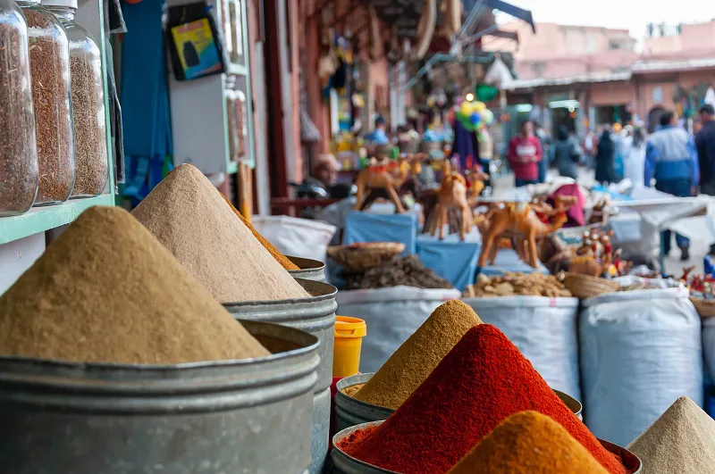 a group of buckets of spices in Marrakesh Landmarks
