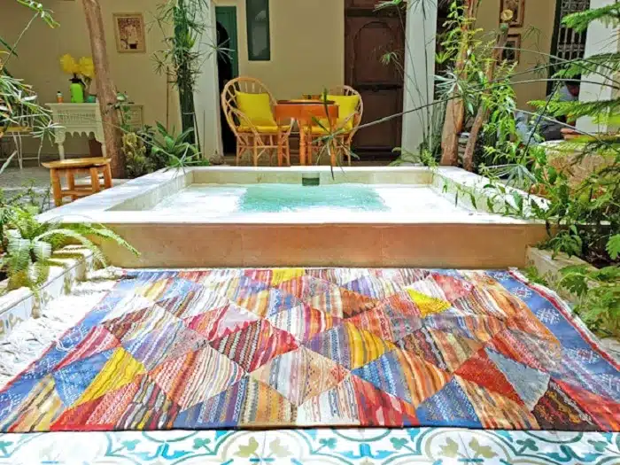a rug in a courtyard Of Traditional Riad in Marrakech
