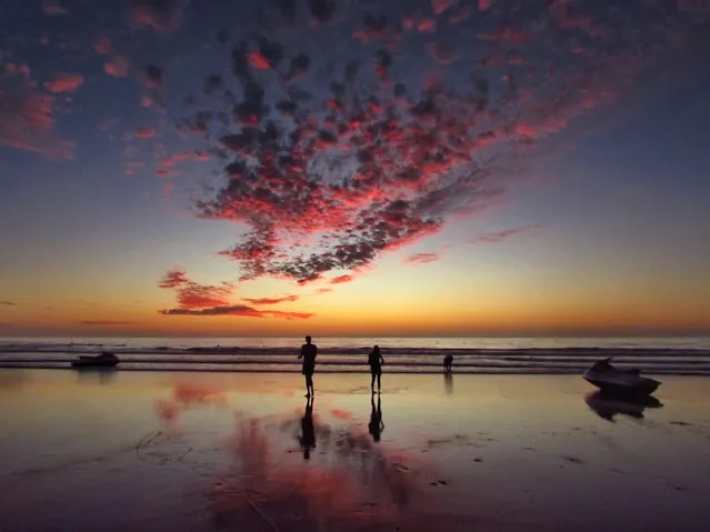 Two Tourists Enjoying Sunset in the Beach of Agadir