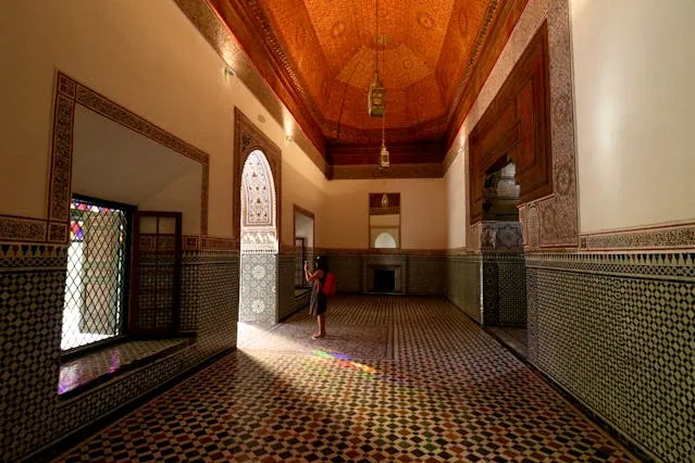 A Young Girl Taking Photo inside Riads in Marrakech