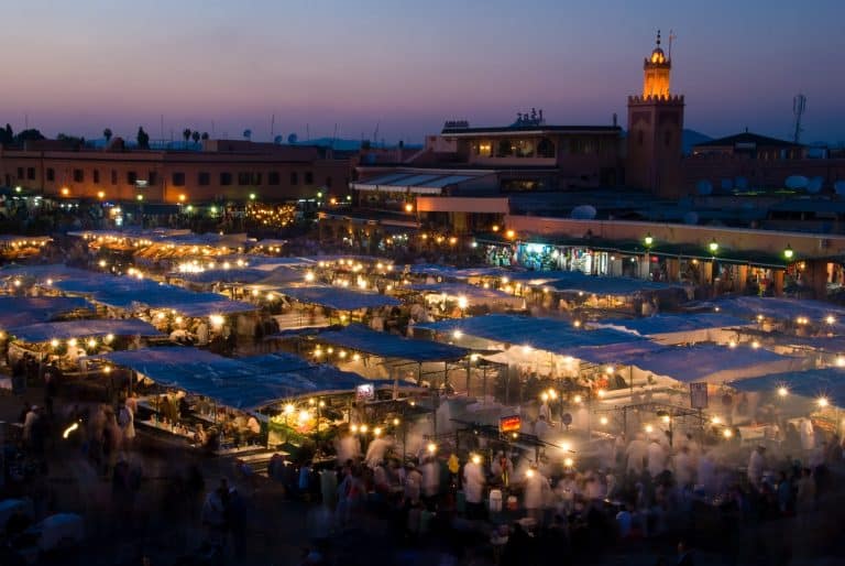 Real photograph of Jemaa el-Fna food stalls at dusk in Marrakech