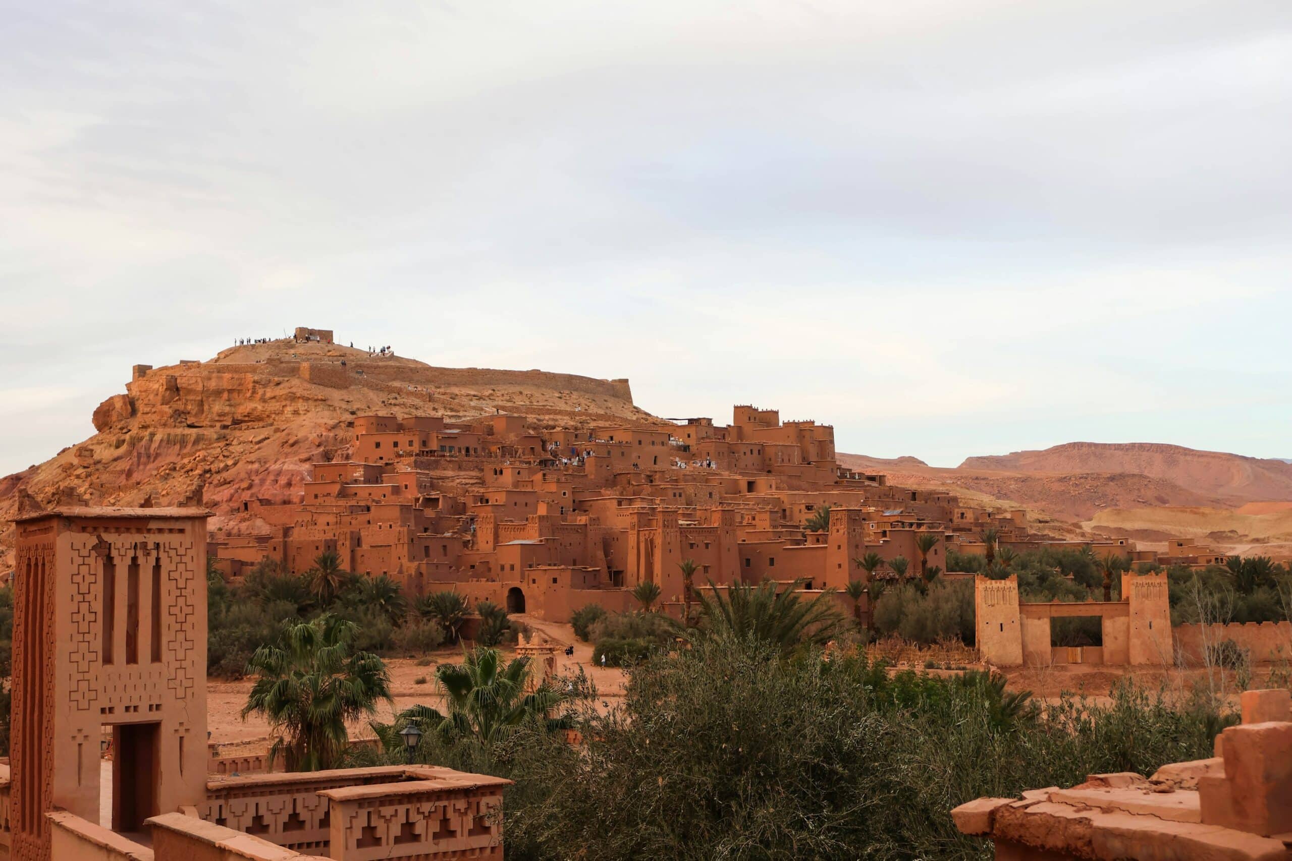 Terracotta kasbahs and palm trees at Aït Benhaddou, Morocco